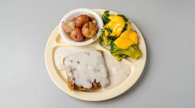 Cubed pork chops with sides at Betty's Bar-B-Q in Anniston, AL